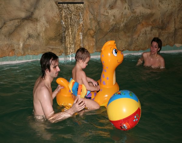 Nudists parents and young generation in a sauna Nudists parents and young generation in a sauna