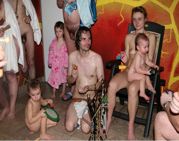 Nudists parents and young generation in a sauna Nudists parents and young generation in a sauna