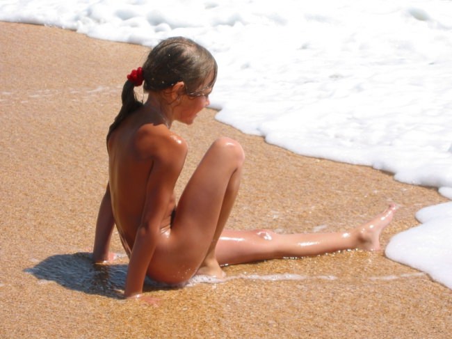 Photoshoot of nudists on a beach