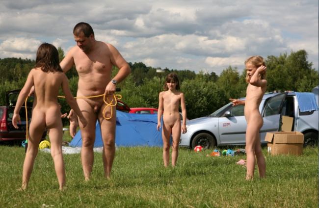 Family naturism - parents and teens naturist bare outdoors