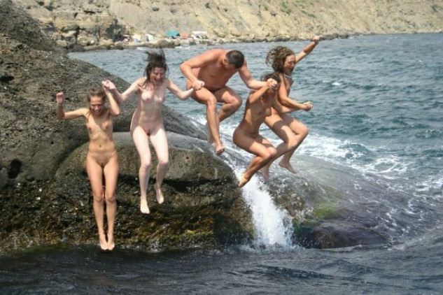 Photo boys and girls nudists on a beach Photo boys and girls nudists on a beach
