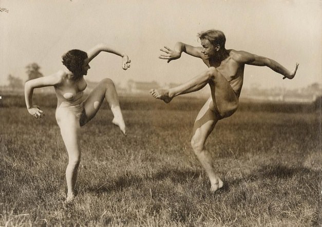 Young nudists at the school dance learn to dance to the music